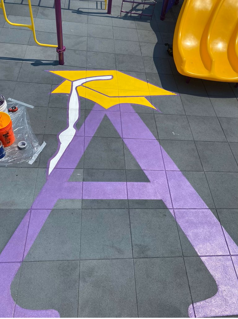 UNITY Surfacing - Painting School Logo on Play Tiles